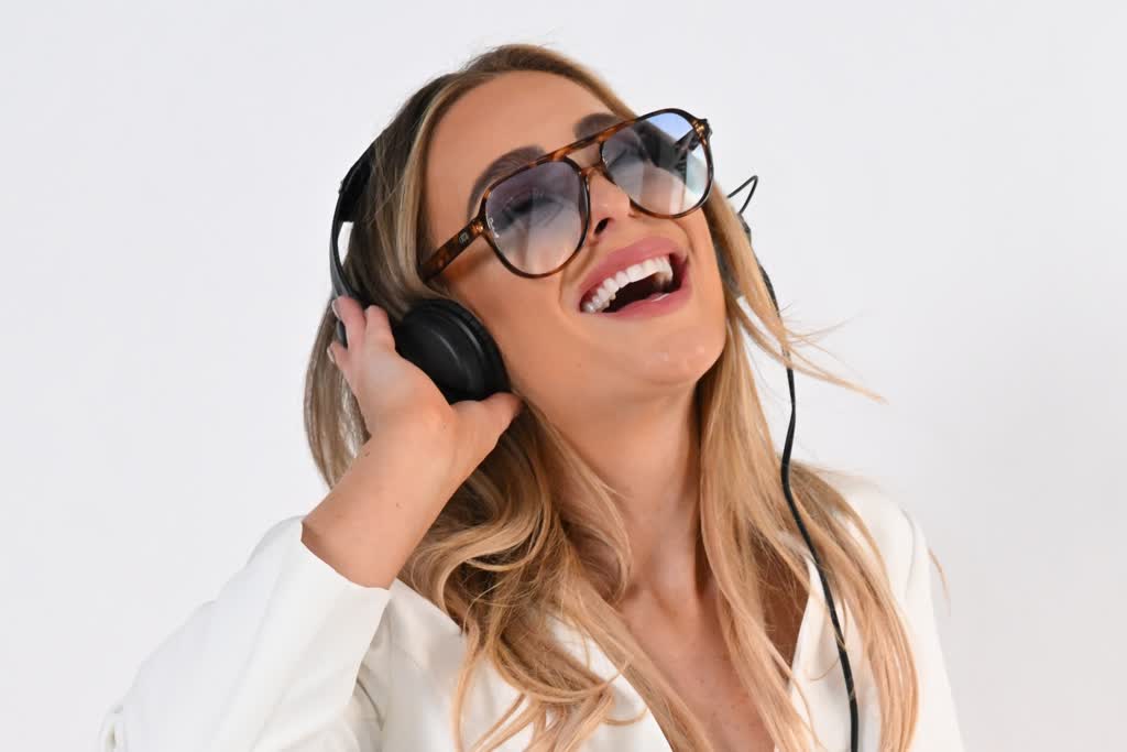 Wedding DJ listening through headphones